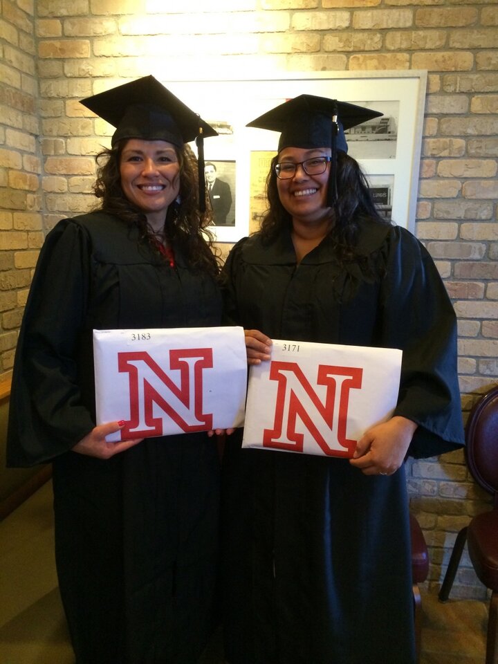 Program Graduates Posing with Degrees